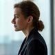 Portrait of a sharp investment manager, mid-40s, contemplative